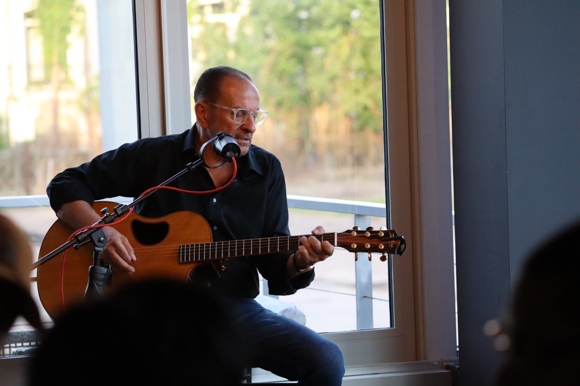 Daniel Foisie performing live on acoustic guitar